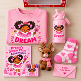 Sugar Plum Christmas gift box contents: pink personalized sweatshirt, Dream tumbler, coloring book, crayons, reindeer plush, cozy socks, and Santa note