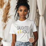 Person wearing a white t-shirt with 'Daughter of the King' text, standing indoors.