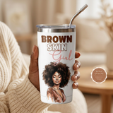 Woman in a cream sweater holding the white Brown Skin Girl insulated tumbler with metal straw