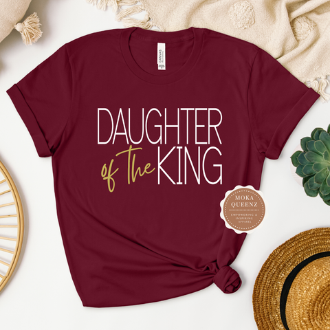 Daughter of the King Tee | Maroon T shirt with gold and white text