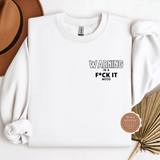 White sweatshirt with text 'WARNING IN A F*CK IT MOOD' on a white background, with a decorative item and brand logo in the corner.