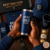 Collection of Father's Day gifts including a navy tumbler, cap, and sweater with 'Best Dad Ever' text.
