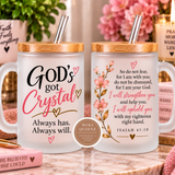 Two frosted glass mugs with bamboo lids and metal straws, displayed side by side on a marble surface. The left mug reads 'GOD's got Crystal Always has.