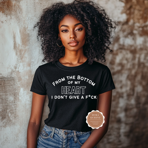 Woman wearing a black t-shirt with a bold statement design against a textured wall.