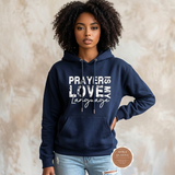 Prayer Is My Love Language hoodie in navy blue with distressed white typography, modeled