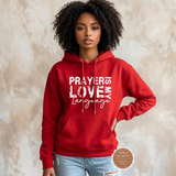 Prayer Is My Love Language hoodie in red with distressed white typography, modeled