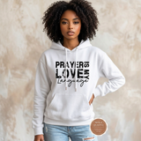 Prayer Is My Love Language hoodie in white with distressed black typography, modeled