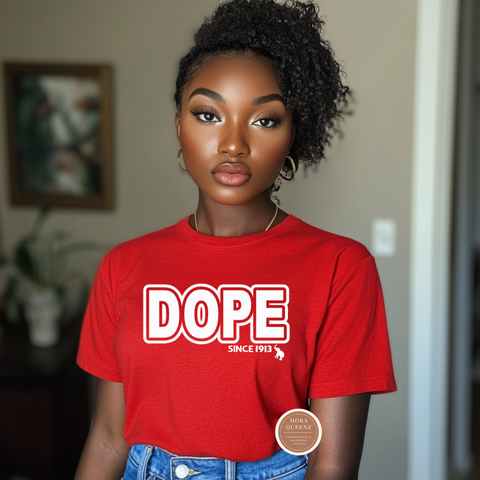 Person wearing a red 'DOPE SINCE 1913' t-shirt with a brand logo.