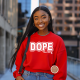 Woman wearing a red sweatshirt with DOPE since 1913 text, standing in an urban setting.