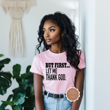 Woman wearing a pink t-shirt with text and a logo in the corner.