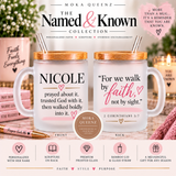 Two frosted glass mugs with bamboo lids and metal straws from Moka Queenz, shown front and back on a styled tabletop with books, a candle, and a pen. The front mug is personalized with the name NICOLE and a scripture quote, while the back mug shows the reverse design.