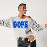 Person wearing a gray sweatshirt with 'DOPE' printed on it, standing against a white background.