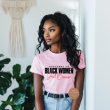 Shout out to black women just because tee, Woman wearing a pink t-shirt with a message, standing indoors with plants in the background