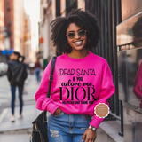Woman wearing a pink sweatshirt with text on a city street