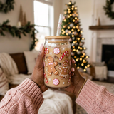 Gingerbread glass can held by a Black woman