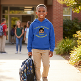 Smiling Black boy holding his backpack outside school wearing a royal blue I Am My Ancestors Wildest Dream hoodie with the name Dante