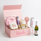 Spa Day personalized gift box for Nicole with a spa headband set, jewelry case, lavender bath salts, Champagne Toast candle, Ferrero Rocher, pink fan, Nicole tumbler and flute, and a mini Martinelli's Sparkling Cider