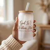 Black woman in a cream sweater holding the God Is Within Her frosted glass can cup