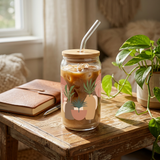 Boho iced coffee glass showing terracotta shapes, cream arches and botanical wrap artwork.