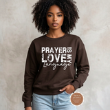 Prayer Is My Love Language sweatshirt in chocolate brown with distressed white typography, modeled