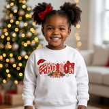 Toddler girl wearing a white personalized Christmas sweatshirt with the name Madison in embroidered-look patch letters