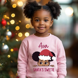 Toddler girl pink personalized Christmas sweatshirt with the name Ava above the words Santa's Sweetie