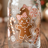 Close-up of the gingerbread girl vinyl design with pink bow, candy canes, and snowflakes on the glass can