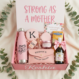 Strong As A Mother personalized gift box for Keshia with a pink water bottle, monogram mirror, makeup bag, sanitizer keychain, Ghirardelli bar, and mini Martinelli's Sparkling Cider