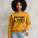 Prayer Is My Love Language sweatshirt in golden yellow with distressed black typography, modeled