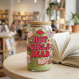 Hot Girls Read glass filled with iced matcha latte beside an open book in a cafe.