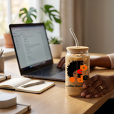 Focused iced coffee glass in a morning home-office setting