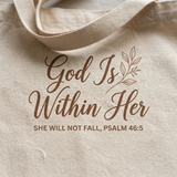 Close-up of the God Is Within Her Psalm 46:5 print on beige canvas