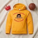 Gold I Am My Ancestors Wildest Dream boys hoodie flat lay with a red toy crown and basketball