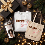 Brown Skin Girl Christmas gift set flat lay with the sweatshirt, white matching tumbler, and Brown Skin Girl tote bag
