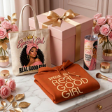 Closed Special Girl Gift Box with gold bow beside the Special Girl tote, one folded Special Girl hoodie, and tumbler on a marble vanity