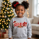 Toddler girl wearing a gray personalized Christmas sweatshirt with the name Madison in embroidered-look patch letters