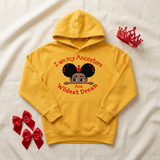 Gold I Am My Ancestors Wildest Dream girls hoodie flat lay with a red toy crown and satin bows