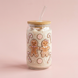 Pink gingerbread 16 oz glass can cup with bamboo lid and glass straw, decorated with gingerbread cookies, bows, and candy canes